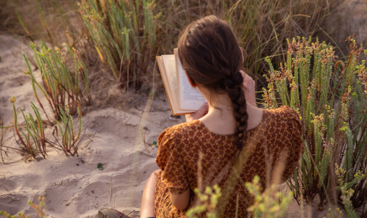 Woman reading at the beach